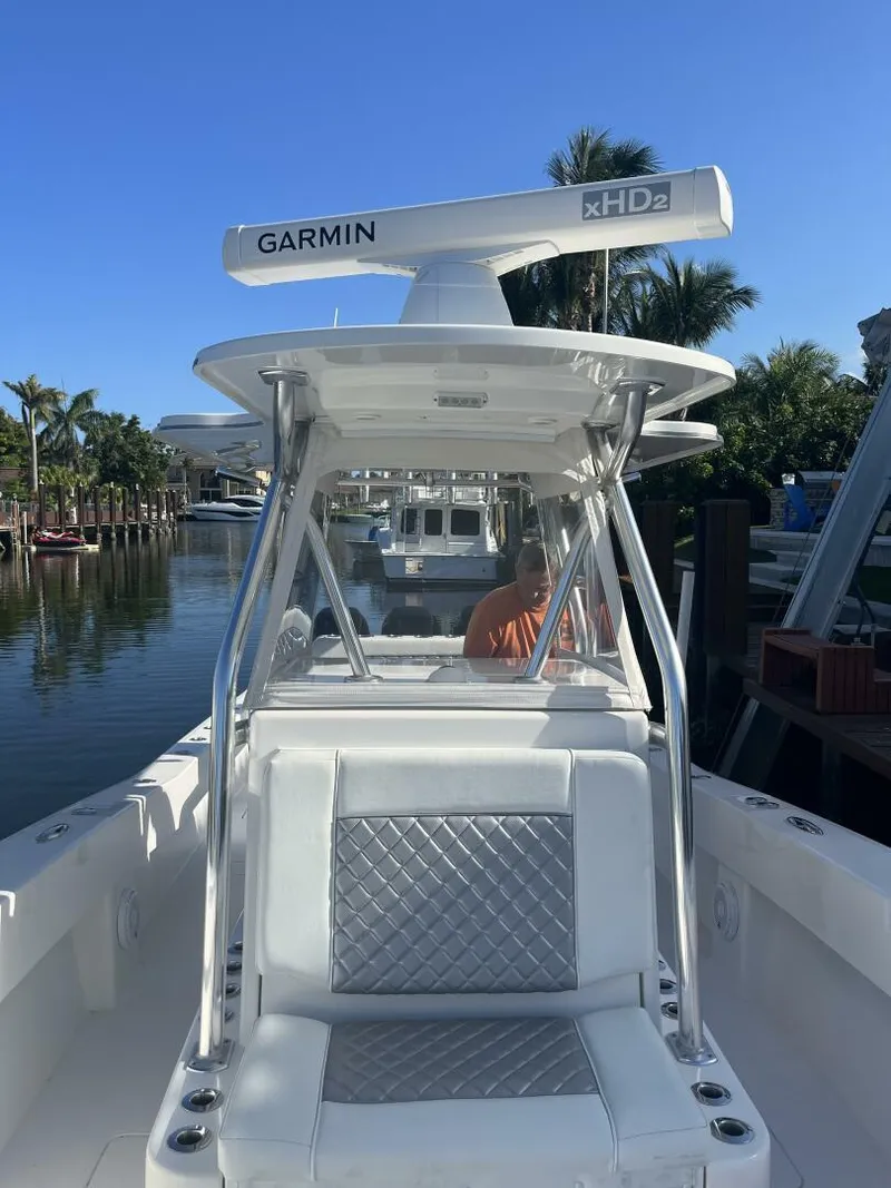 Slide: The Image of 2016 Invincible 36 CC boat with Garmin xHD2 radar on a calm waterway. - 6