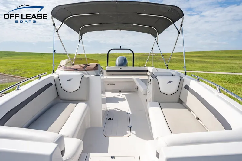Slide: The Image of 2022 Starcraft SVX 191 OB boat interior with seating and canopy. - 4