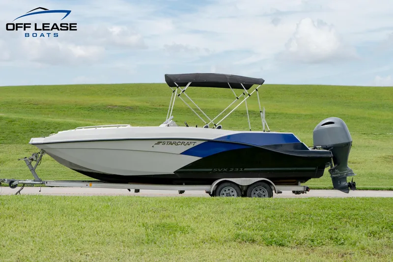 Slide: The Image of 2022 Starcraft SVX 231 OB boat on trailer, side view. - 7