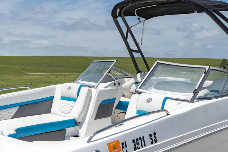 Slide: The Image of 2020 Hurricane 217 SD boat with blue and white interior, open deck, and windshield. - 5