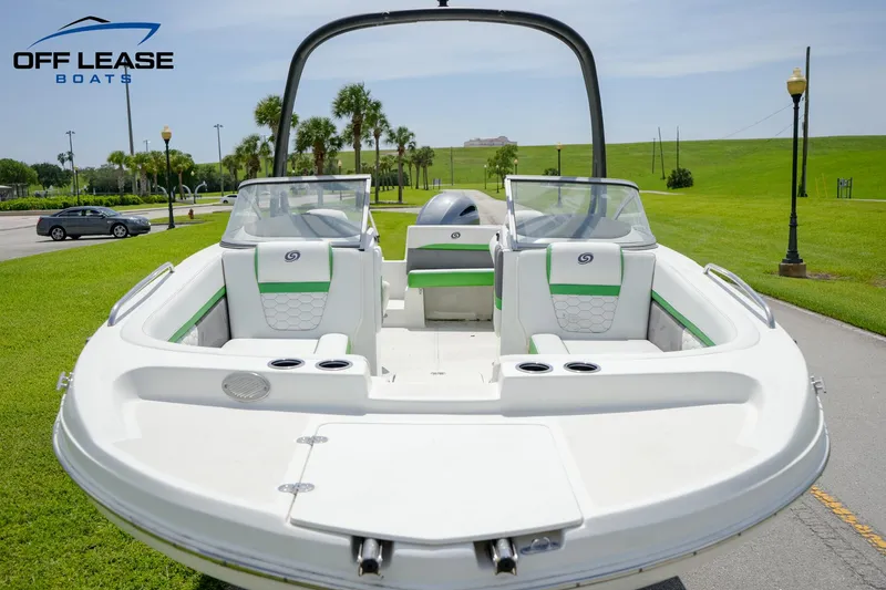Slide: The Image of 2020 Hurricane 217 SD boat with green accents, spacious seating, and modern design. - 3
