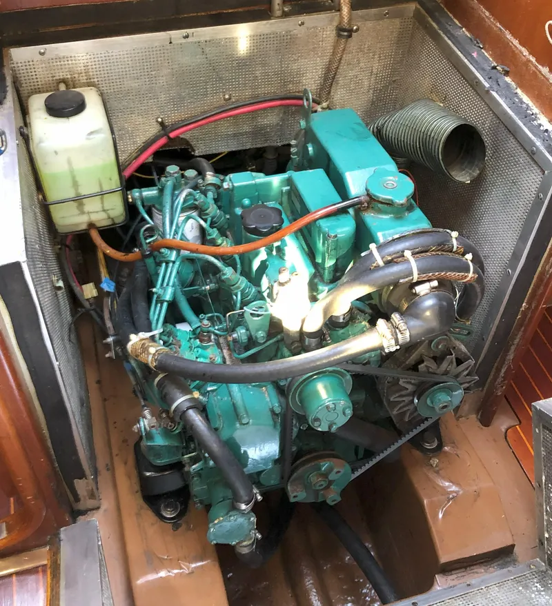 Slide: The Image of 1988 Nautor Swan 36-2 engine compartment with green marine diesel engine. - 12
