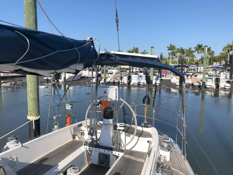 Slide: The Image of Nautor Swan 36-2 sailboat, 1988 model, docked at a marina with clear blue skies. - 4