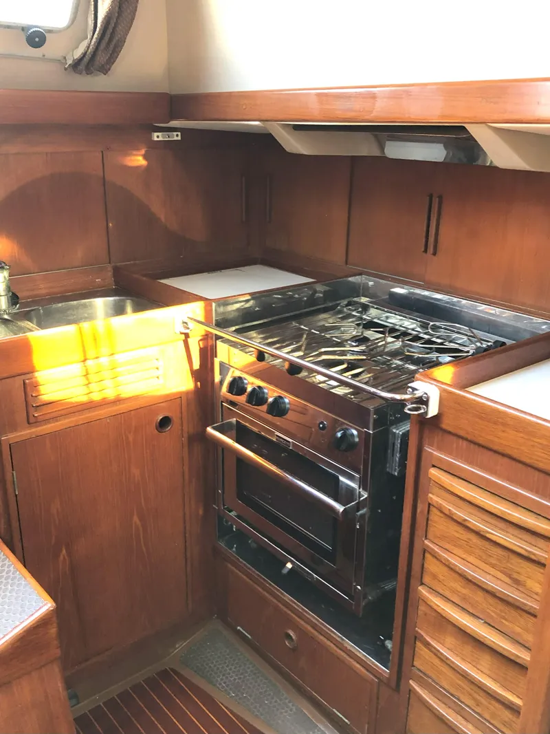 Slide: The Image of 1988 Nautor Swan 36-2 yacht kitchen with stove, oven, and sink. - 7