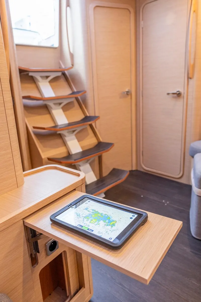 Slide: The Image of Interior of 2025 Dufour 44 yacht with modern design and navigation tablet. - 8