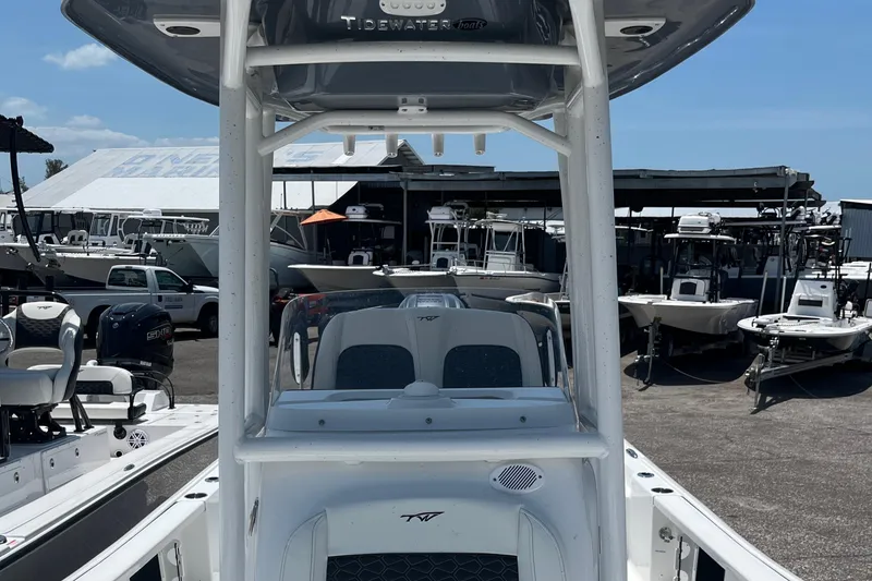 Slide: The Image of 2024 Tidewater 2210 Carolina Bay boat at a marina. - 10