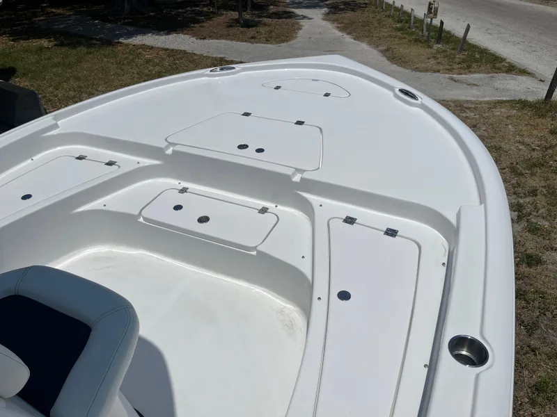 Slide: The Image of 2024 Tidewater 2210 Carolina Bay boat deck with storage compartments. - 3