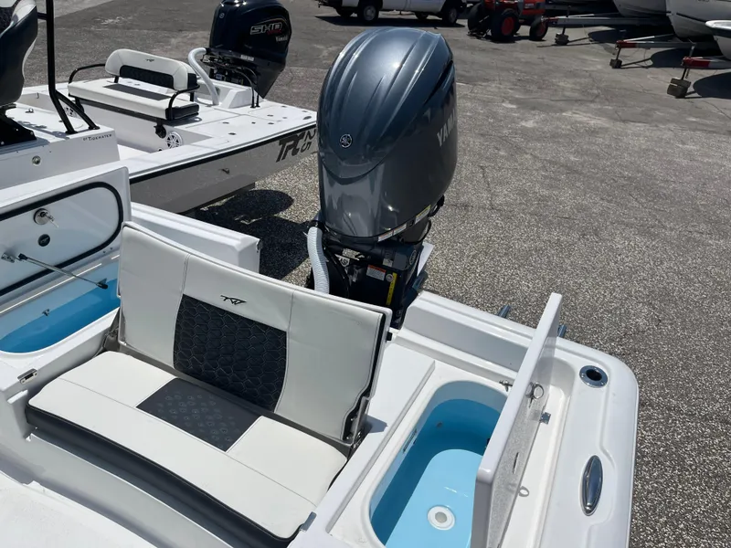 Slide: The Image of 2024 Tidewater 2210 Carolina Bay boat with Yamaha outboard motor and seating. - 6