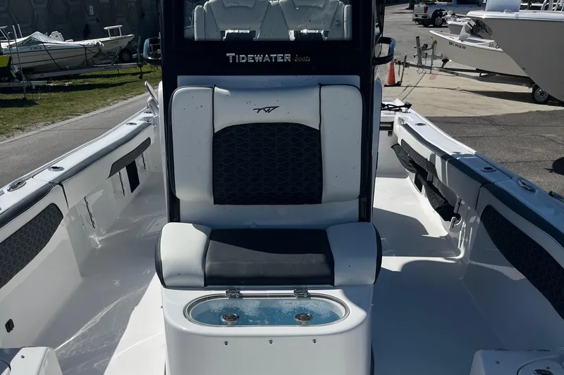 Slide: The Image of 2025 Tidewater 2700 Carolina Bay boat interior with seating and storage. - 13