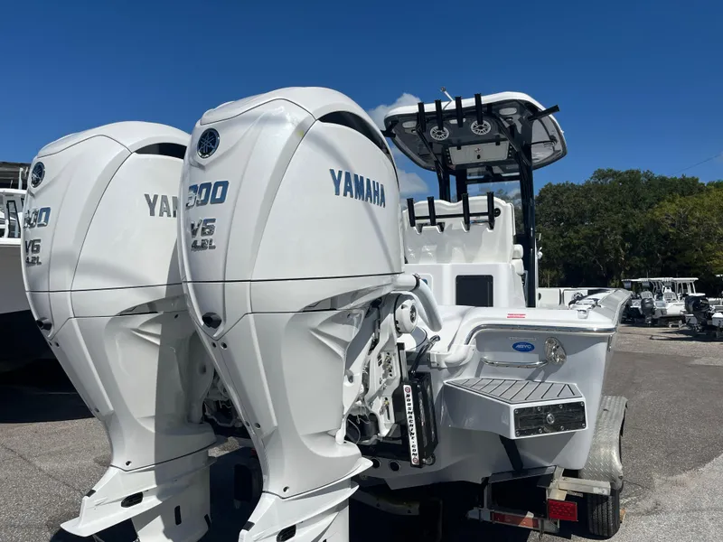 Slide: The Image of 2025 Tidewater 2700 Carolina Bay with twin Yamaha 300 V6 outboard engines. - 2