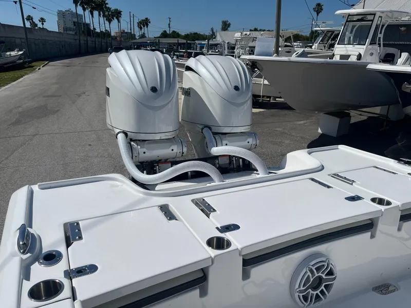 Slide: The Image of 2025 Tidewater 2700 Carolina Bay boat with dual outboard engines. - 4