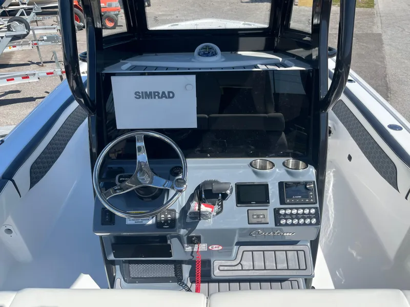 Slide: The Image of 2025 Tidewater 2700 Carolina Bay boat console with Simrad electronics. - 5