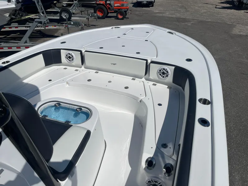 Slide: The Image of 2025 Tidewater 2700 Carolina Bay boat interior with seating and storage compartments. - 6
