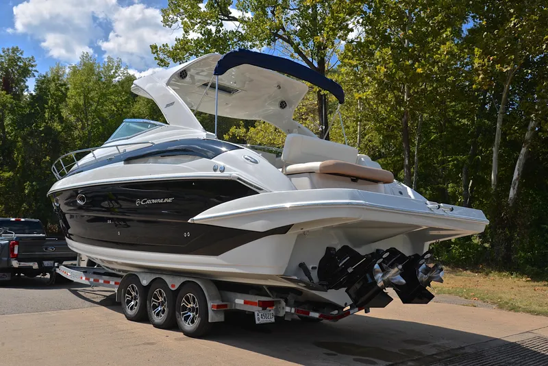 Slide: The Image of 2020 Crownline 350 SY boat on a trailer, ready for transport. - 17