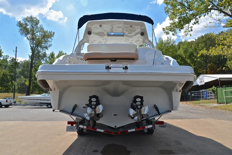 Slide: The Image of 2020 Crownline 350 SY boat rear view with dual propellers. - 18
