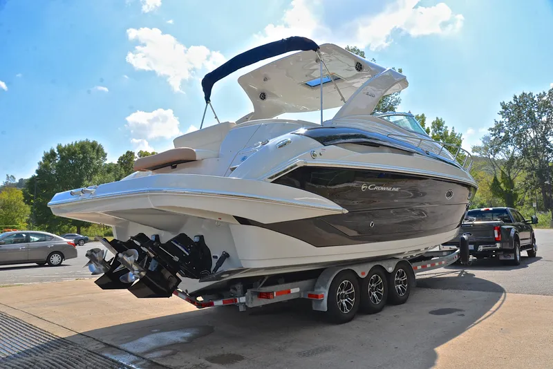 Slide: The Image of 2020 Crownline 350 SY boat on a trailer, rear view. - 19