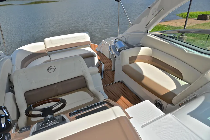 Slide: The Image of 2020 Crownline 350 SY boat interior with luxurious seating and modern helm. - 27