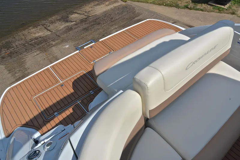 Slide: The Image of Crownline 350 SY 2020 model boat with tan and white seating and wooden deck. - 29