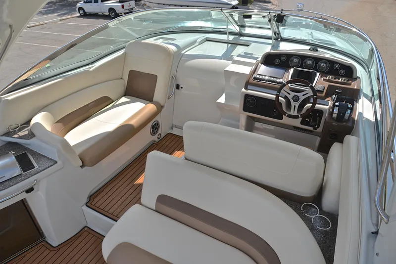 Slide: The Image of 2020 Crownline 350 SY boat interior with helm, seating, and dashboard. - 31