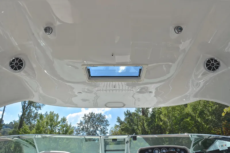Slide: The Image of Interior view of 2020 Crownline 350 SY boat with skylight and speakers. - 37