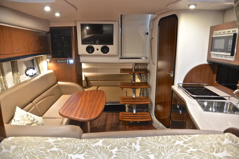 Slide: The Image of Interior of 2020 Crownline 350 SY yacht with modern kitchen and cozy seating area. - 45