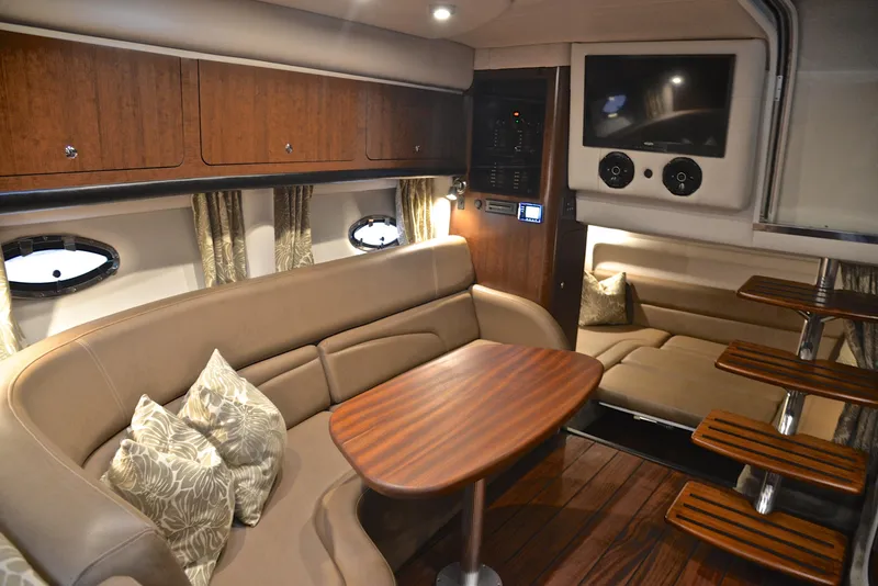 Slide: The Image of Luxurious interior of 2020 Crownline 350 SY yacht with plush seating and wooden table. - 46