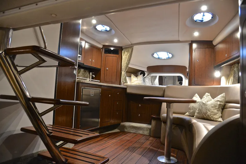 Slide: The Image of Interior of 2020 Crownline 350 SY yacht with modern kitchen and seating area. - 48