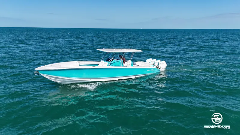 Slide: The Image of 2020 Nor-Tech 390 Sport boat cruising on open water. - 10