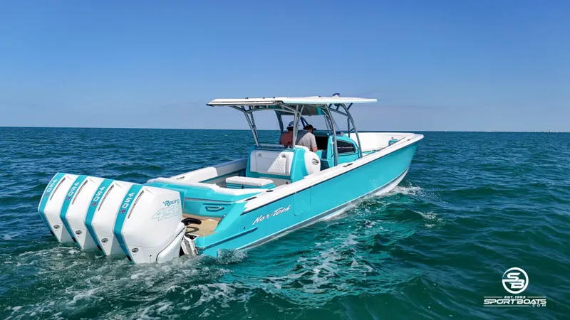 Slide: The Image of 2020 Nor-Tech 390 Sport boat cruising on open water. - 12
