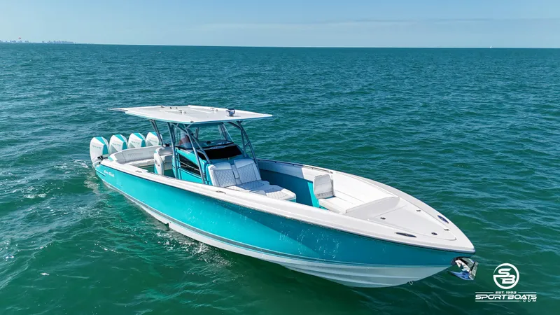 Slide: The Image of 2020 Nor-Tech 390 Sport boat cruising on open water. - 14