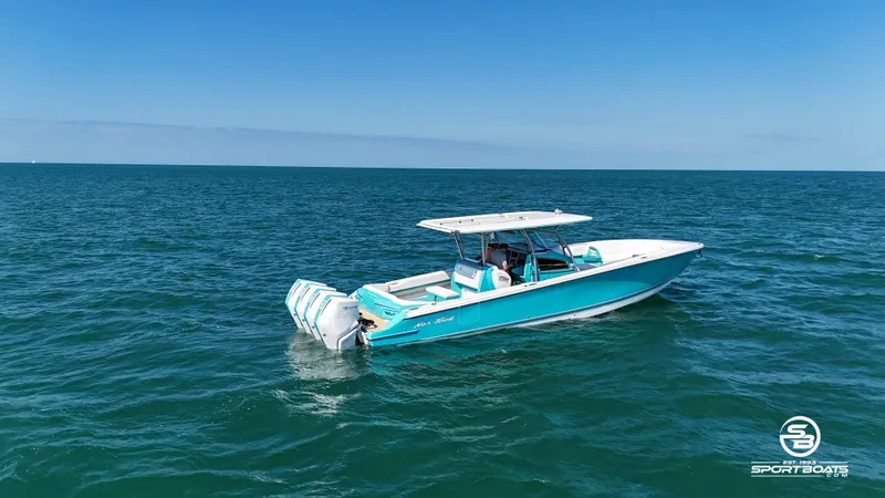 Slide: The Image of 2020 Nor-Tech 390 Sport boat cruising on open water. - 15