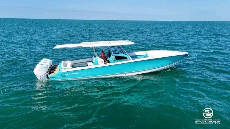 Slide: The Image of 2020 Nor-Tech 390 Sport boat cruising on open water. - 17