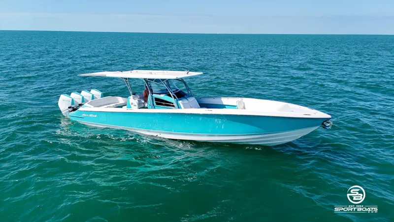 Slide: The Image of 2020 Nor-Tech 390 Sport boat cruising on open water. - 18