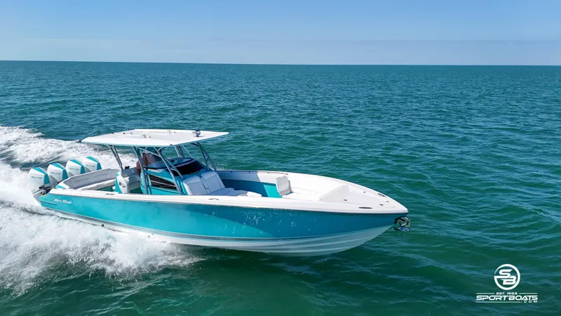 Slide: The Image of 2020 Nor-Tech 390 Sport boat cruising on open water. - 19