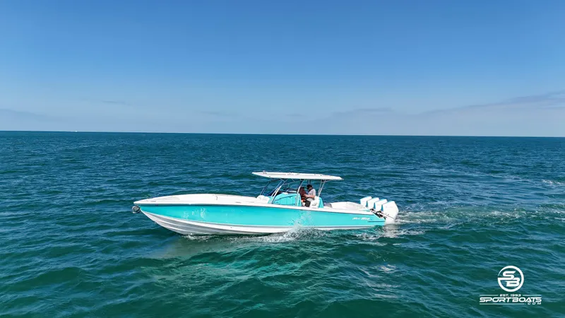 Slide: The Image of 2020 Nor-Tech 390 Sport boat cruising on open water. - 2