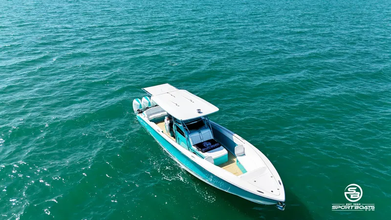 Slide: The Image of 2020 Nor-Tech 390 Sport boat cruising on open water. - 20