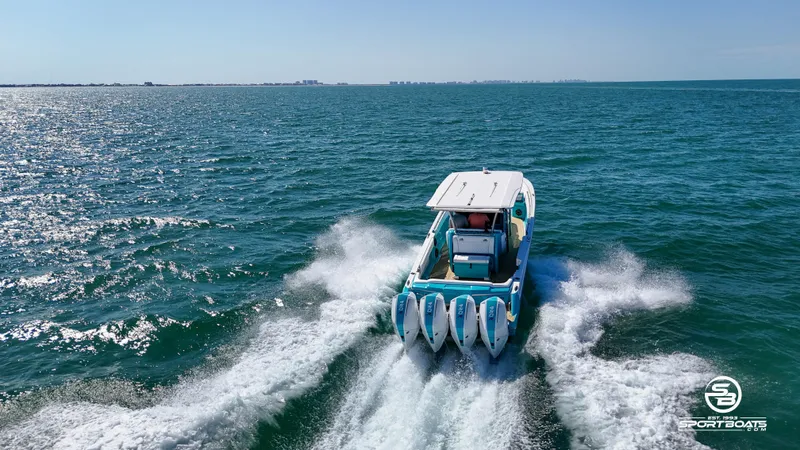 Slide: The Image of 2020 Nor-Tech 390 Sport boat cruising on open water. - 22