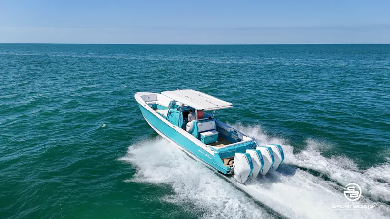 Slide: The Image of 2020 Nor-Tech 390 Sport boat cruising on open water. - 23