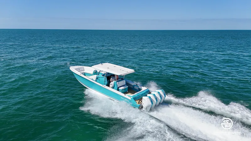 Slide: The Image of 2020 Nor-Tech 390 Sport boat cruising on open water. - 24