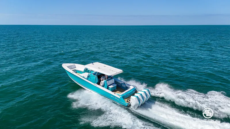 Slide: The Image of 2020 Nor-Tech 390 Sport boat cruising on open water. - 25