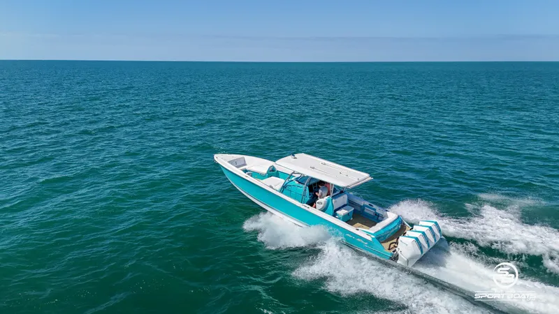 Slide: The Image of 2020 Nor-Tech 390 Sport boat cruising on open water. - 27