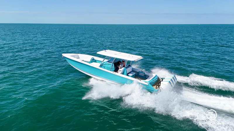 Slide: The Image of 2020 Nor-Tech 390 Sport boat cruising on open water. - 28