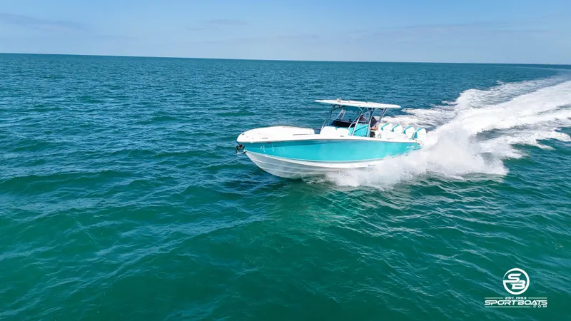 Slide: The Image of 2020 Nor-Tech 390 Sport boat speeding on open water. - 29