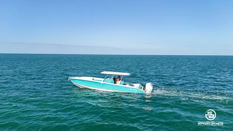Slide: The Image of 2020 Nor-Tech 390 Sport boat cruising on open water. - 3