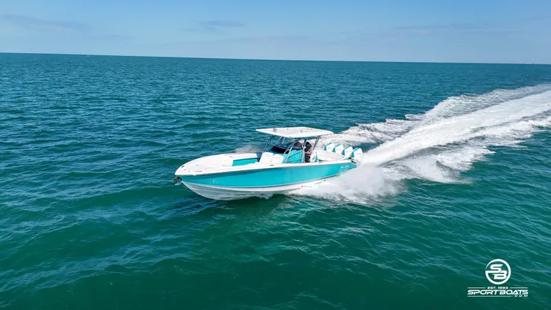 Slide: The Image of 2020 Nor-Tech 390 Sport boat cruising on open water. - 31