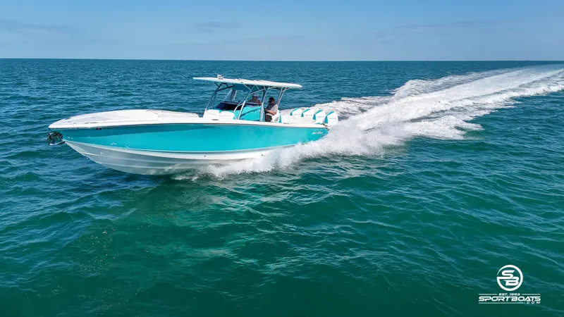 Slide: The Image of 2020 Nor-Tech 390 Sport boat cruising on open water. - 33