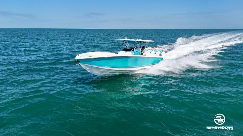 Slide: The Image of 2020 Nor-Tech 390 Sport boat cruising on open water. - 34