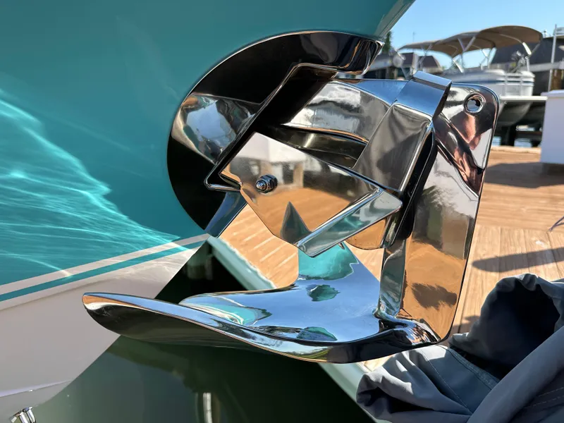 Slide: The Image of Close-up of a 2020 Nor-Tech 390 Sport boat's polished stainless steel anchor. - 37