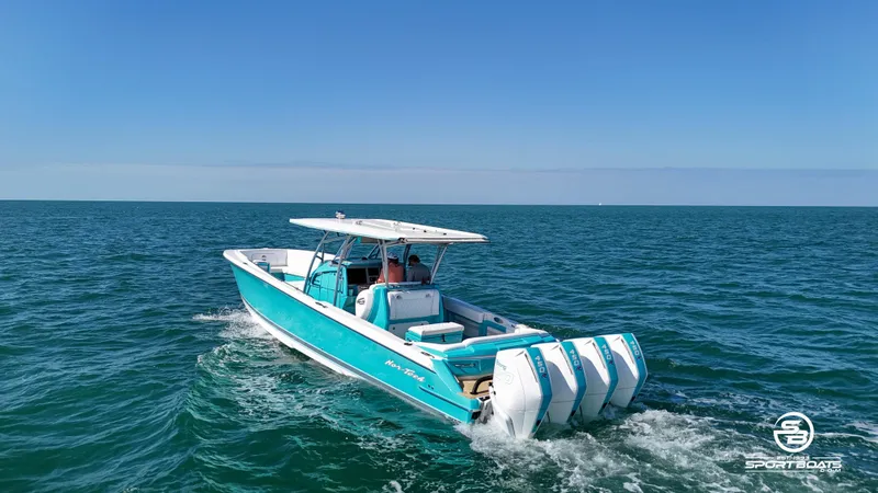Slide: The Image of 2020 Nor-Tech 390 Sport boat cruising on open water. - 4