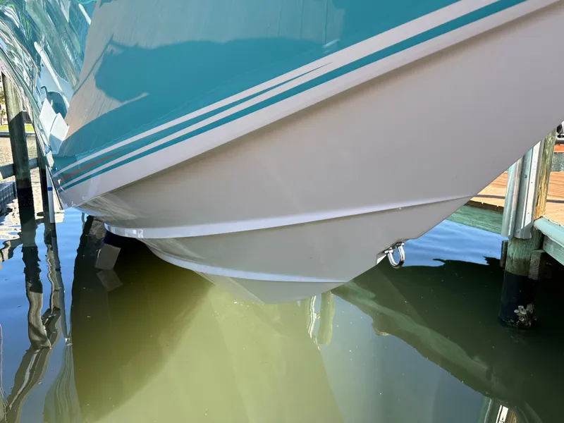Slide: The Image of 2020 Nor-Tech 390 Sport boat hull in water, close-up view. - 41